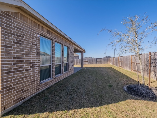 view of yard with a fenced backyard