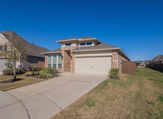 view of front of home featuring driveway, fence, a front yard, a garage, and brick siding