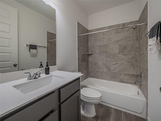 bathroom featuring toilet, shower / washtub combination, and vanity