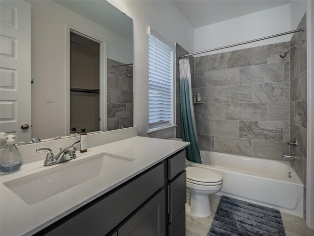 full bathroom featuring shower / bathtub combination with curtain, toilet, vanity, and tile patterned flooring