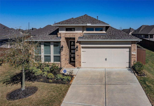 view of front of home with an attached garage, brick siding, driveway, and a shingled roof