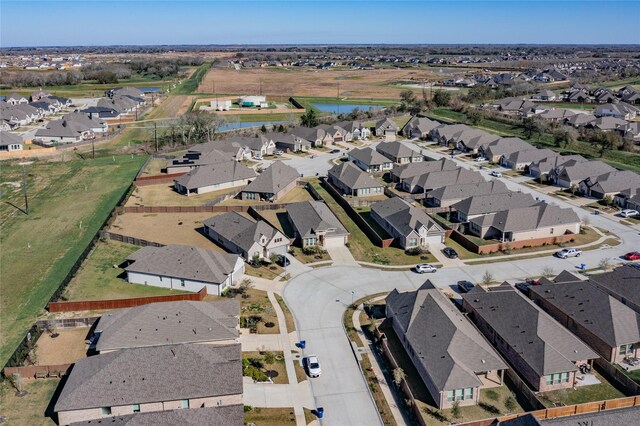 bird's eye view featuring a residential view and a water view