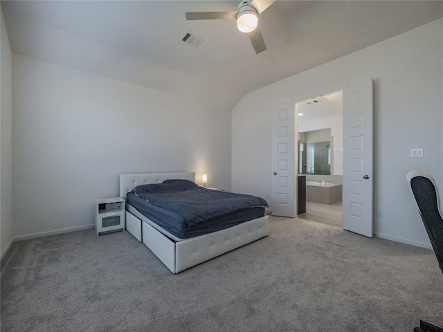 carpeted bedroom with visible vents, baseboards, ensuite bathroom, and ceiling fan