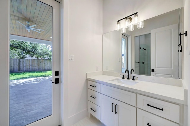 full bathroom featuring vanity and a shower