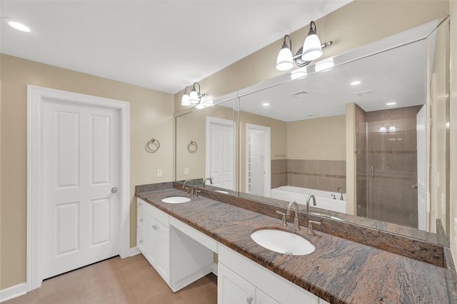 full bath with tile patterned floors, double vanity, a stall shower, a bath, and a sink