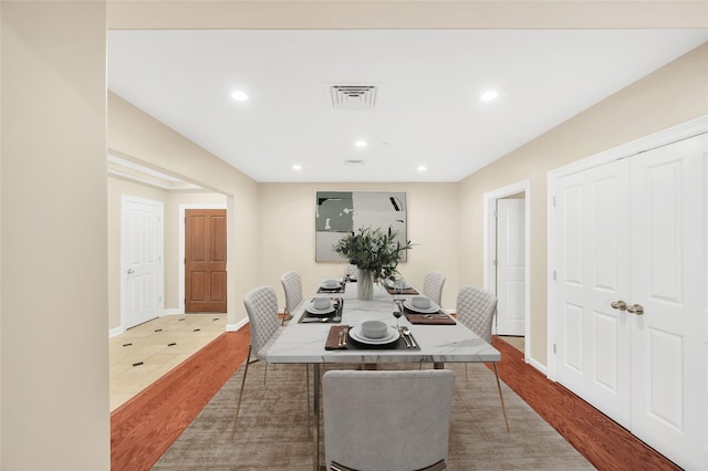 dining space with recessed lighting, visible vents, baseboards, and wood finished floors