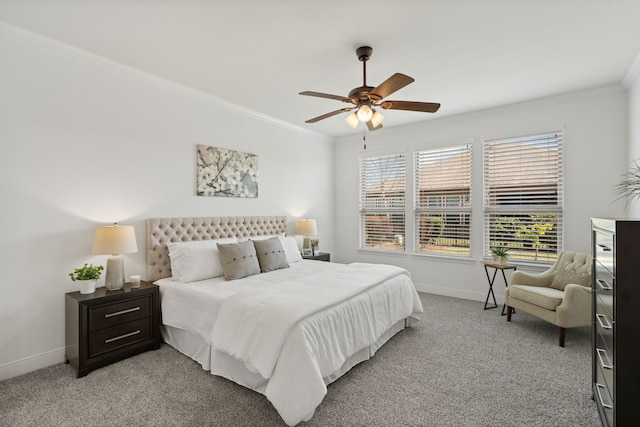 bedroom with baseboards, light carpet, and crown molding