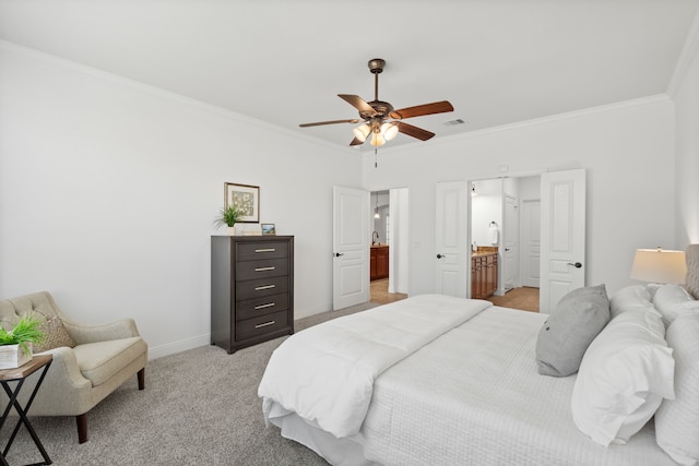 bedroom featuring baseboards, light colored carpet, ornamental molding, ensuite bathroom, and a ceiling fan