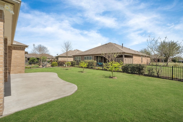 view of yard featuring a patio and a fenced backyard