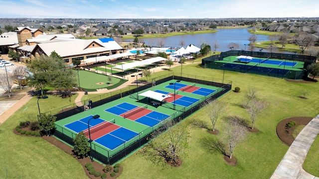 drone / aerial view with a residential view and a water view