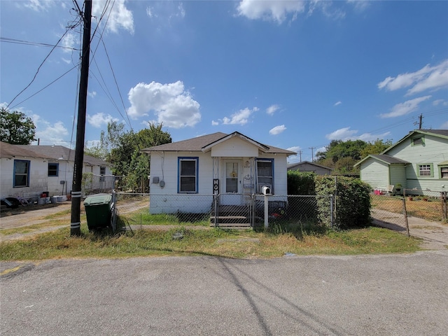 view of front of home featuring a fenced front yard and a gate