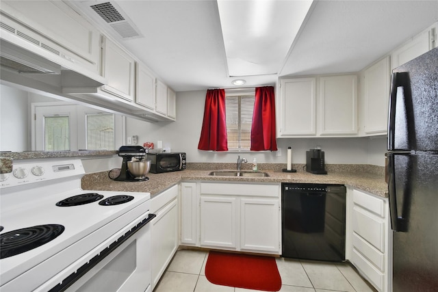 kitchen featuring black appliances, light tile patterned floors, white cabinets, and a sink