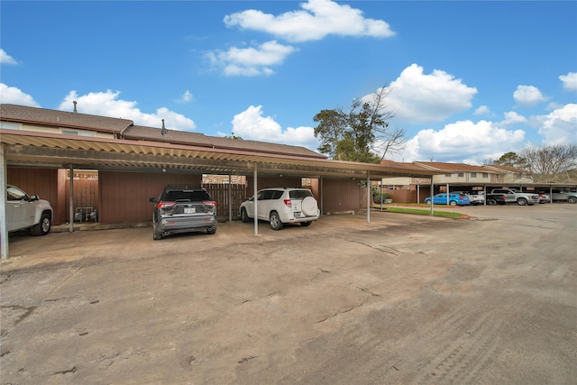 covered parking lot with fence