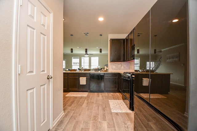 kitchen featuring visible vents, decorative backsplash, dark brown cabinets, light wood-type flooring, and black appliances