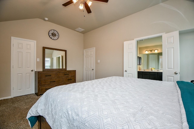 bedroom featuring lofted ceiling, ensuite bath, ceiling fan, visible vents, and carpet floors