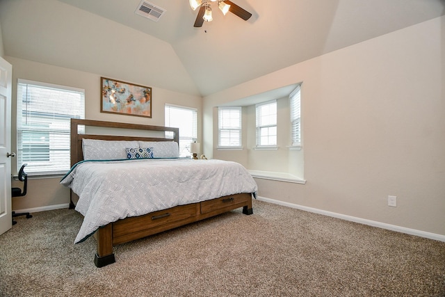 carpeted bedroom with lofted ceiling, baseboards, multiple windows, and visible vents