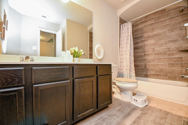 full bathroom featuring toilet, shower / tub combo, wood tiled floor, and vanity