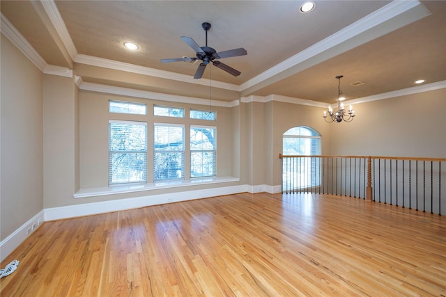 spare room with crown molding, recessed lighting, wood finished floors, and baseboards