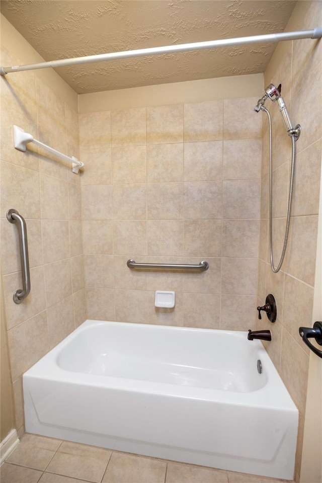 full bathroom with tile patterned floors, tub / shower combination, and a textured ceiling