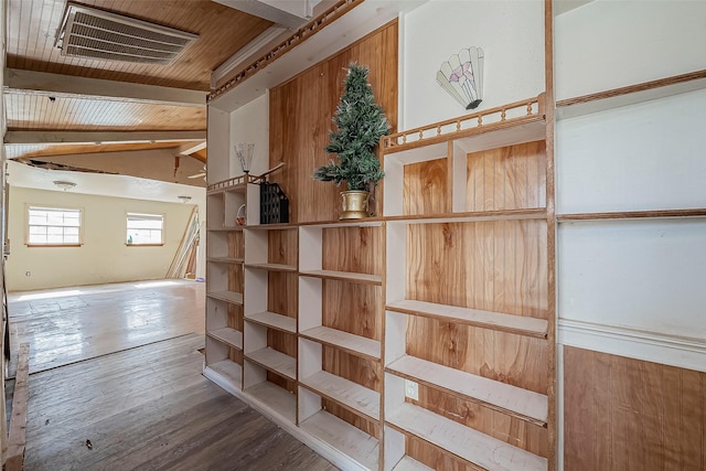 interior space with lofted ceiling with beams, wooden ceiling, visible vents, and hardwood / wood-style floors