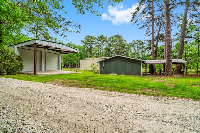 view of pole building with a yard