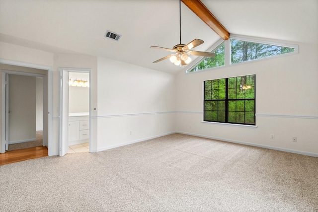 empty room featuring carpet floors, a ceiling fan, visible vents, baseboards, and beamed ceiling