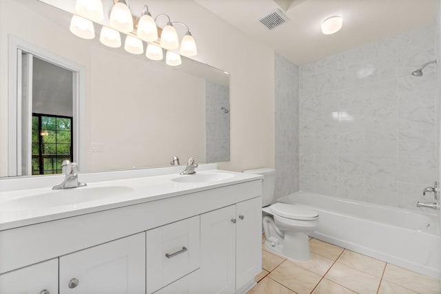 full bath featuring double vanity, visible vents, toilet, a sink, and tile patterned floors