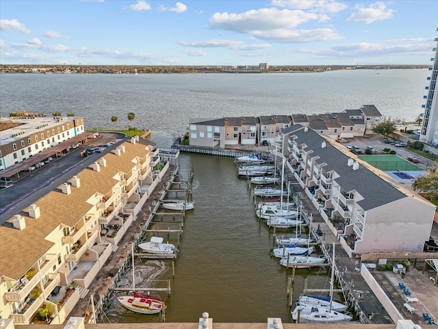 birds eye view of property with a water view