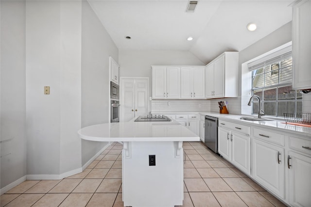 kitchen featuring light tile patterned floors, visible vents, stainless steel appliances, and a sink