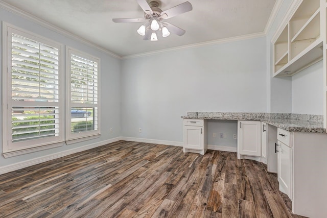 interior space with white cabinetry, dark wood-style floors, open shelves, built in desk, and crown molding