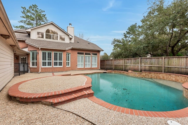 view of swimming pool featuring a fenced in pool, a patio area, and a fenced backyard