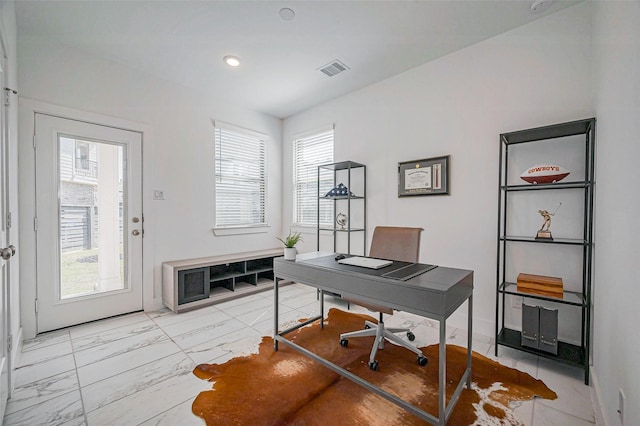 office space with visible vents, marble finish floor, and baseboards