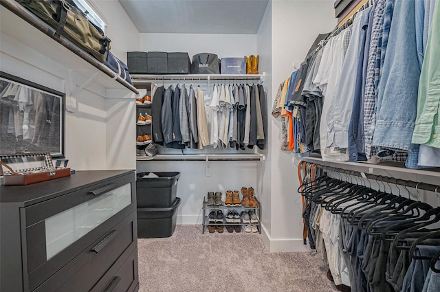 walk in closet with carpet