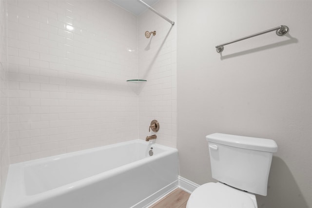 13540 Diamond Reef Ln, Texas City, TX 77568 - full bath featuring baseboards, shower / bathing tub combination, toilet, and wood finished floors