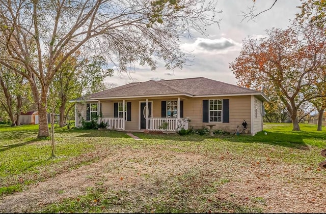 ranch-style house with a porch and a front yard