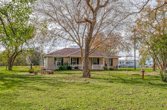 view of front of home with a porch and a front yard