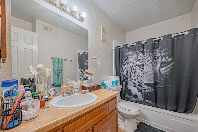 full bath featuring visible vents, a textured wall, toilet, a textured ceiling, and vanity