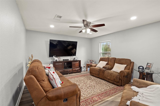 living room with recessed lighting, visible vents, ceiling fan, wood finished floors, and baseboards