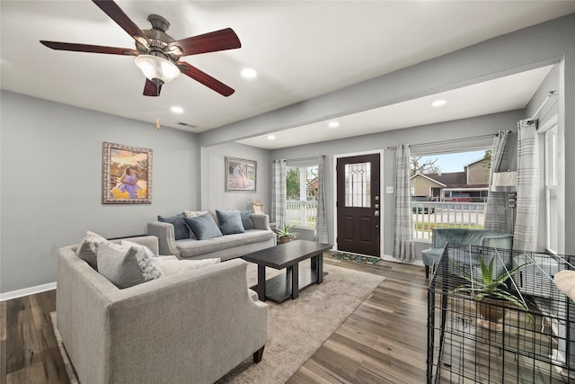 living area featuring baseboards, visible vents, ceiling fan, wood finished floors, and recessed lighting