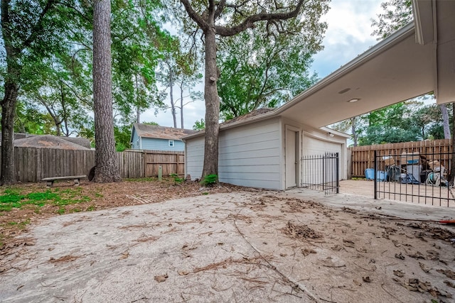 garage with fence