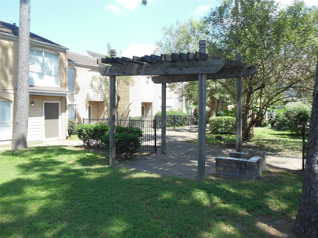 view of home's community with a patio area, a lawn, and a pergola