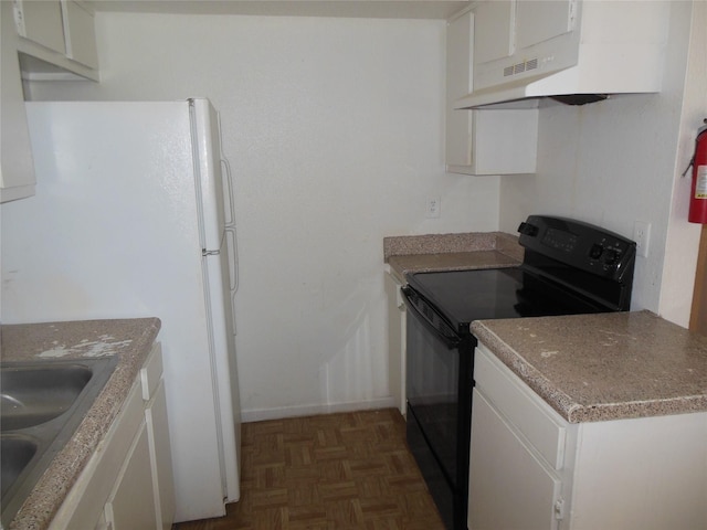 kitchen with black electric range, freestanding refrigerator, white cabinets, a sink, and under cabinet range hood