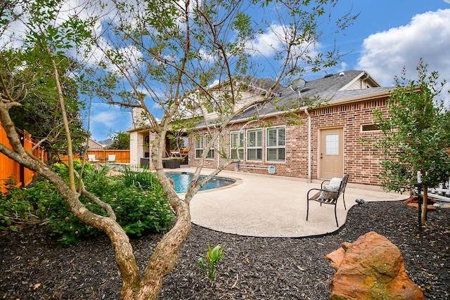 pool featuring a patio area and a fenced backyard