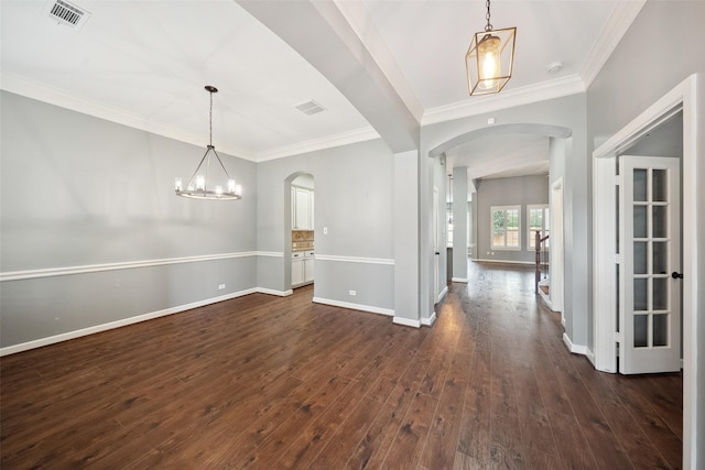 interior space featuring arched walkways, visible vents, dark wood finished floors, and baseboards