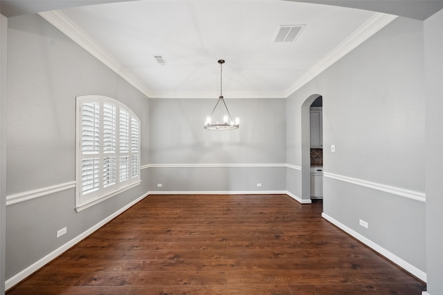 unfurnished dining area with baseboards, visible vents, dark wood-style flooring, and ornamental molding