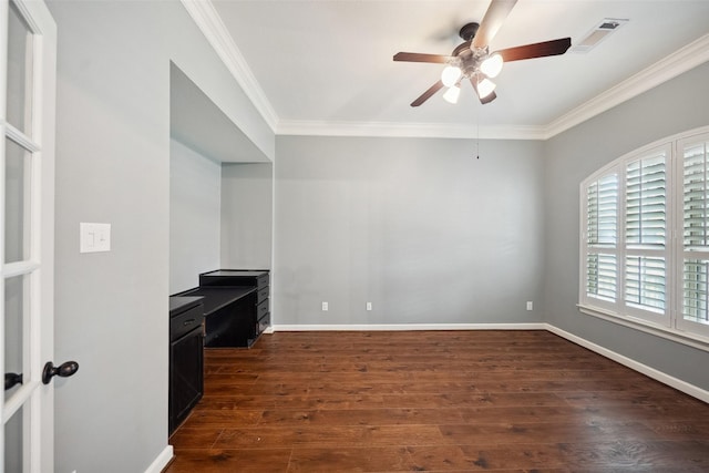 office with crown molding, visible vents, dark wood-type flooring, a ceiling fan, and baseboards