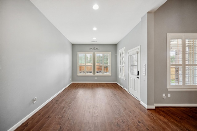 entryway featuring recessed lighting, wood finished floors, and baseboards