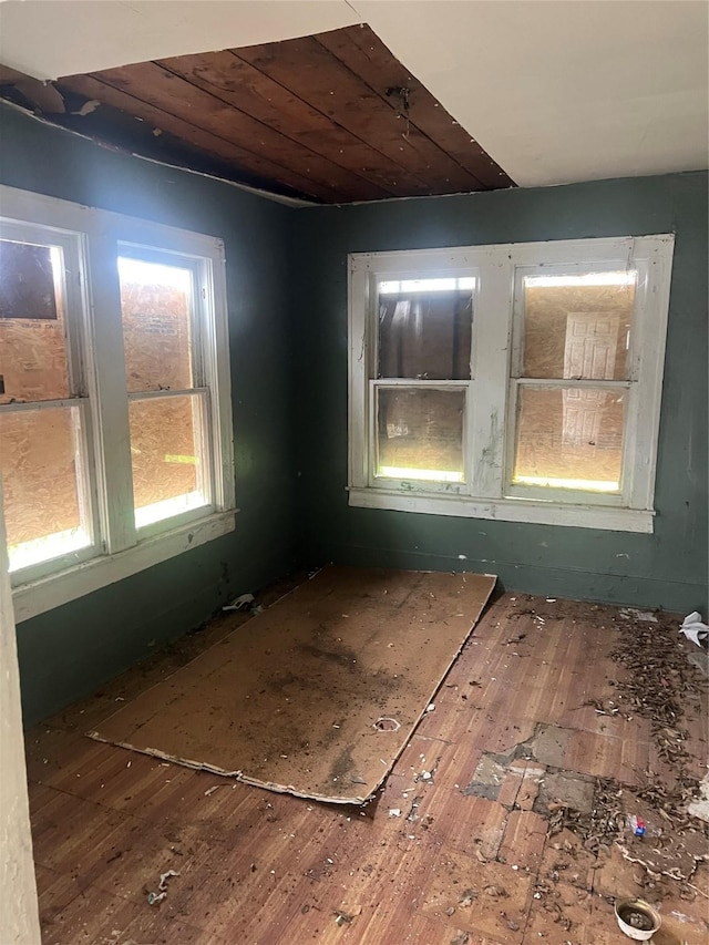 empty room featuring wood ceiling