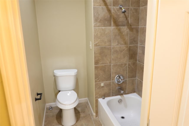 full bathroom featuring shower / bath combination, tile patterned flooring, toilet, and baseboards