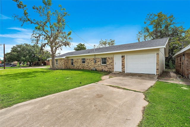 single story home with a garage, brick siding, driveway, and a front yard